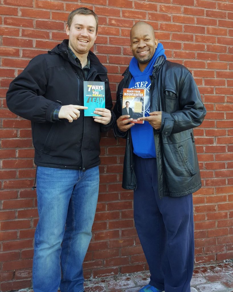 Authors Jeff Davis and Robert Kennedy III exchange the books they wrote.